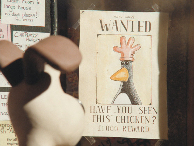 A wanted poster showing a penguin with a red glove on its head and the text 'Have you seen this chicken?'